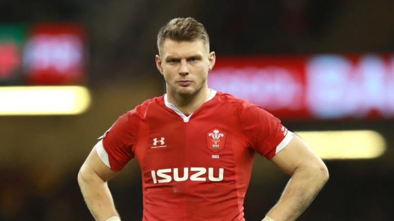 Biggar's heavily strapped knee