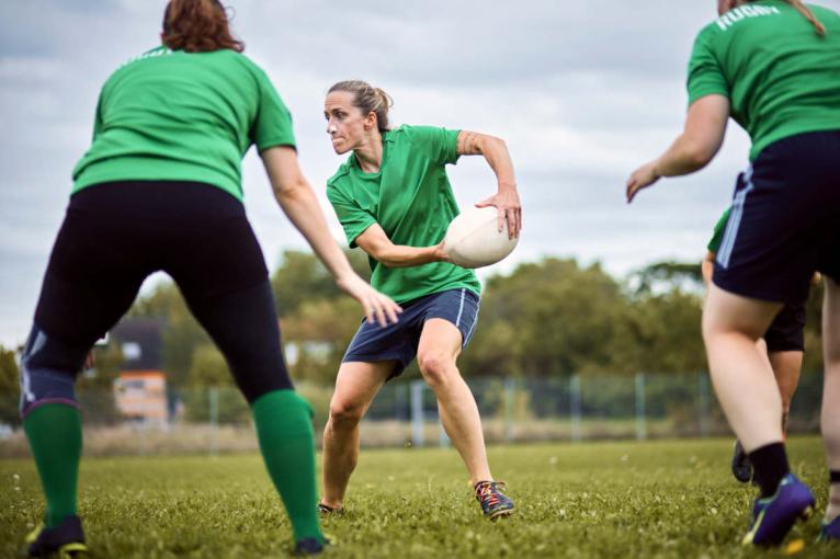 Women playing rugby