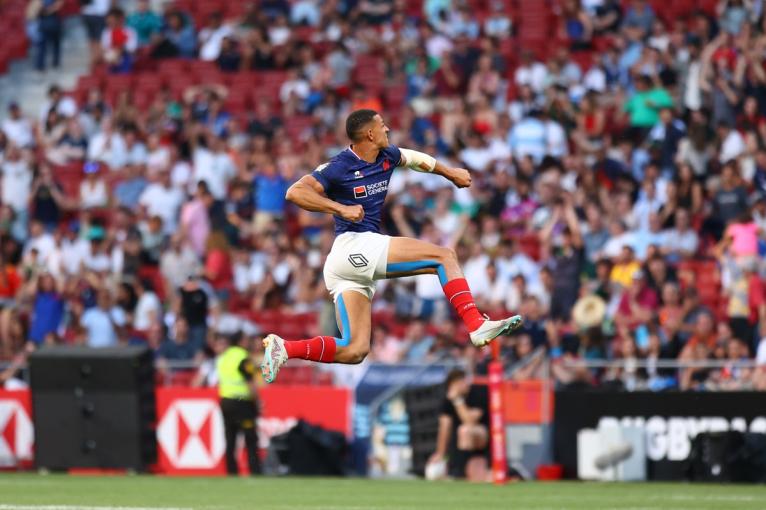 Aaron Grandidier Nkanang jumping high into the air in celebration