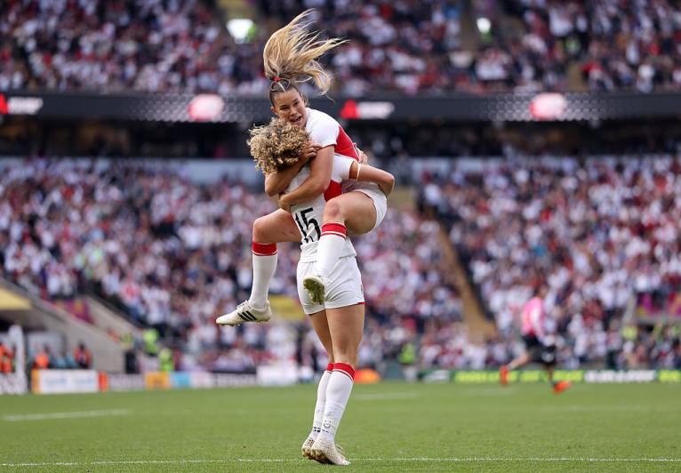 Ellie Kildunne of England celebrates scoring her team's first try with Jess Breach