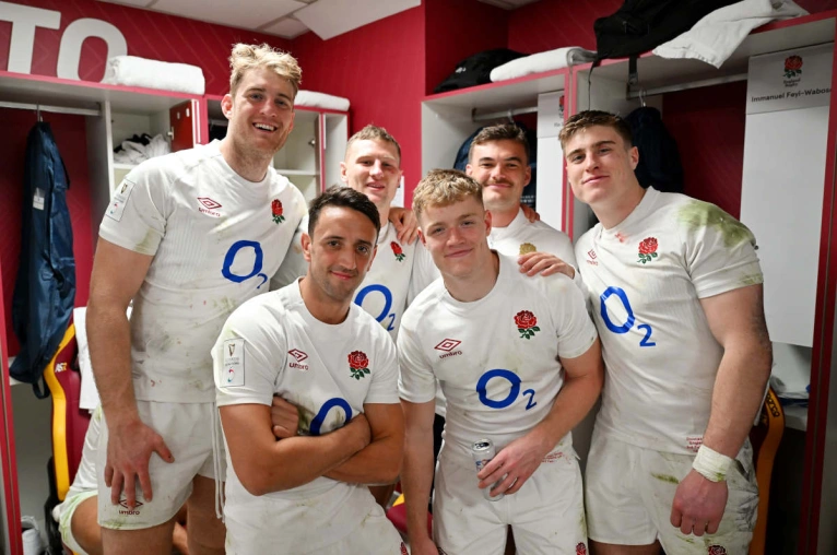 Six Saints players celebrate a win over England