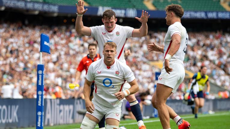 Alex Dombrandt of England reacts to scoring his side's fourth try alongside team-mates <a href=