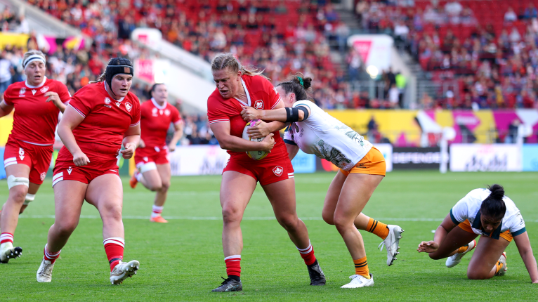 Emily Tuttosi of Canada is tackled by <a href=