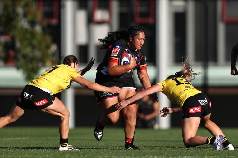 Veisinia Mahutariki-Fakalelu of the Chiefs Manawa is tackled during the round five Super Rugby Aupiki match between Hurricanes Poua and Chiefs Manawa