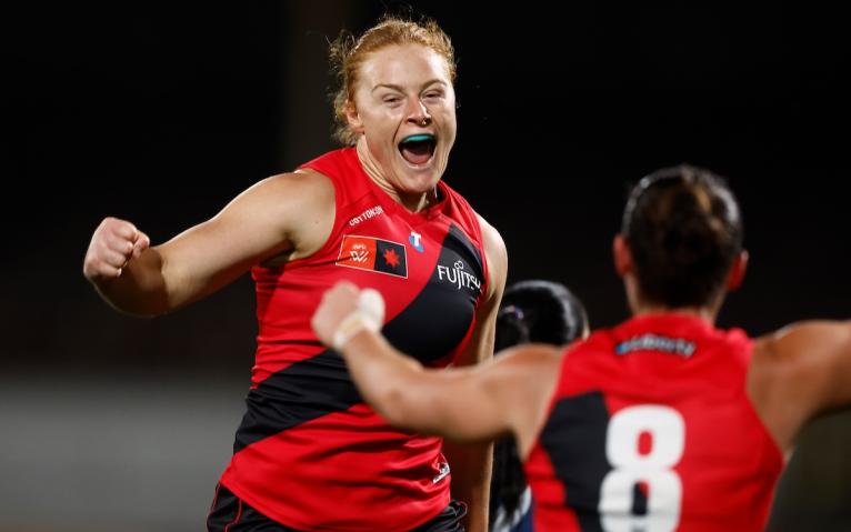 Grace Brooker of the Bombers celebrates during the 2025 AFLW Round 08 match between the Melbourne Demons and the Essendon Bombers 