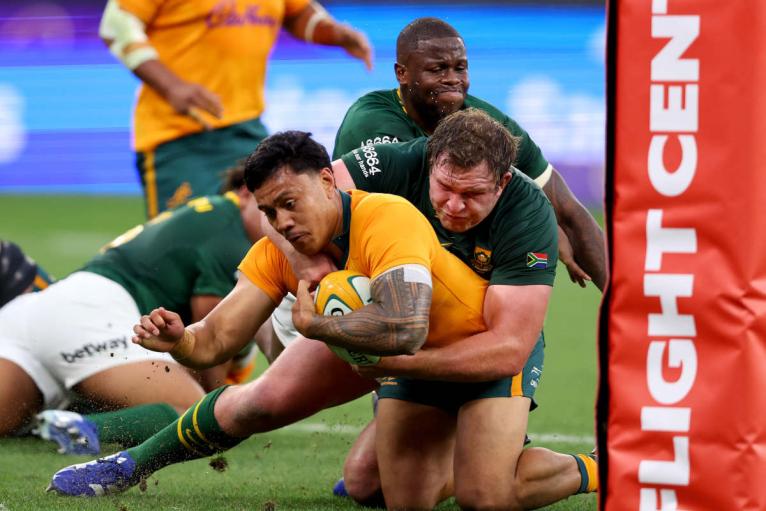 Len Ikitau scores a try against South Africa