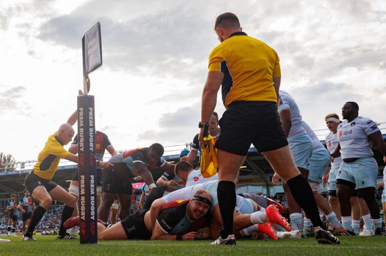 Will Hobson looks up as he scores Harlequins' first try against Northampton