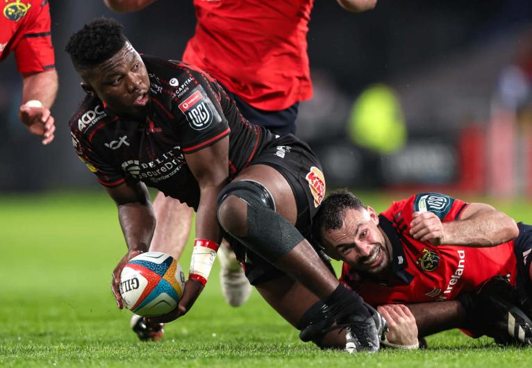 Sibabalwe Mahashe offloads for Lions after being tackled