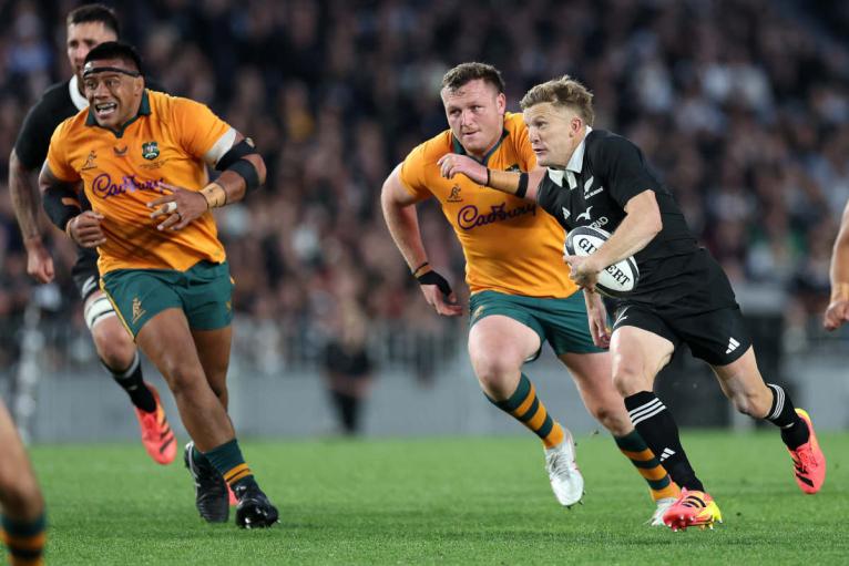 Allan Ala'alatoa chases back as Damian McKenzie makes a break