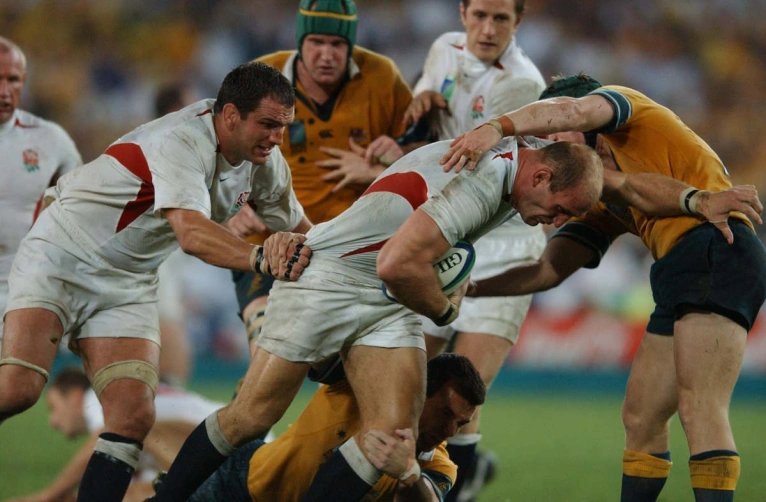 Lawrence Dallaglio carries the ball into Australia's defence with Martin Johnson in support