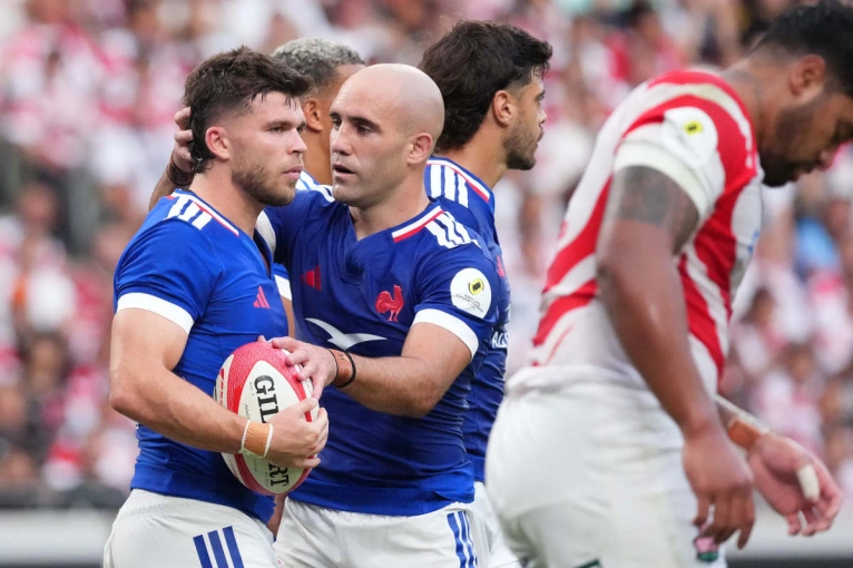 Maxime Lucu congratulates Mathieu Jalibert for scoring a try against Japan