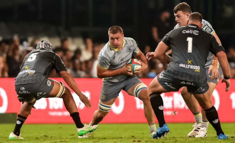 Leinster No.8 Josh Ericson carries the ball against the Sharks