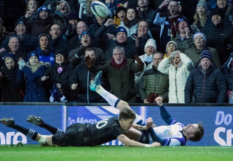 Stuart Hogg loses the ball after Beauden Barrett's tackle in 2017