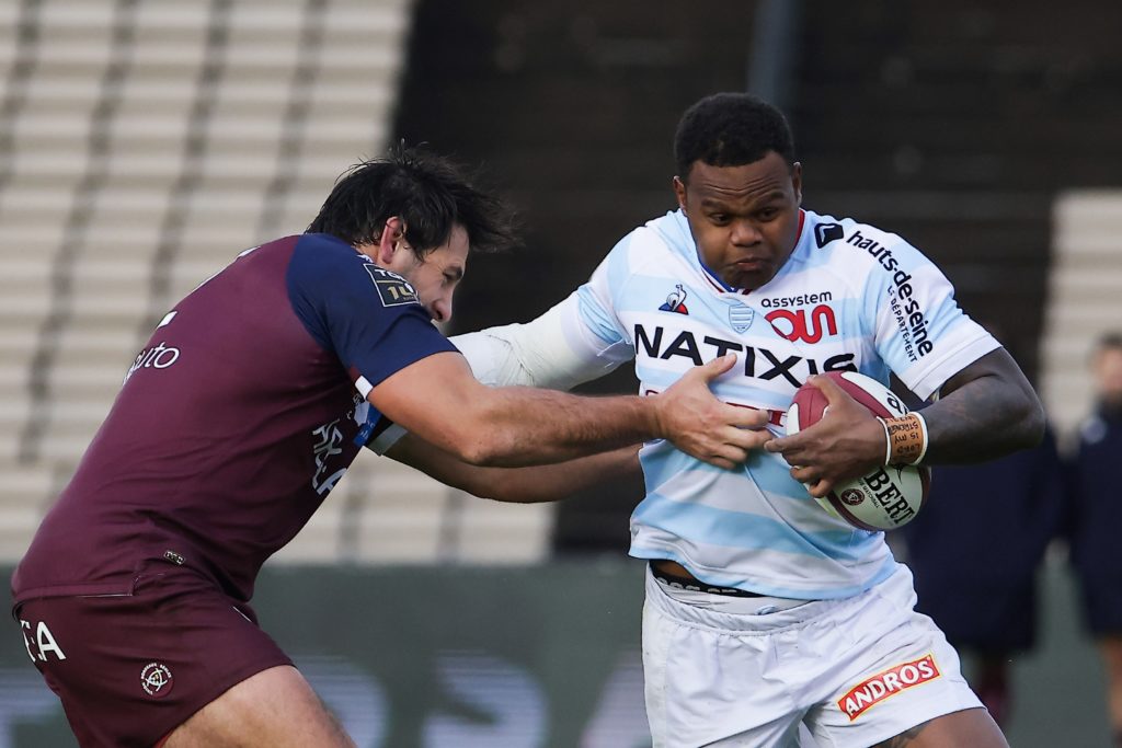 Virimi Vakatawa hands off an opponent in action for Racing 92